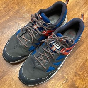 Salomon casual shoes size 10.5 gray with blue and orange accents and white soles